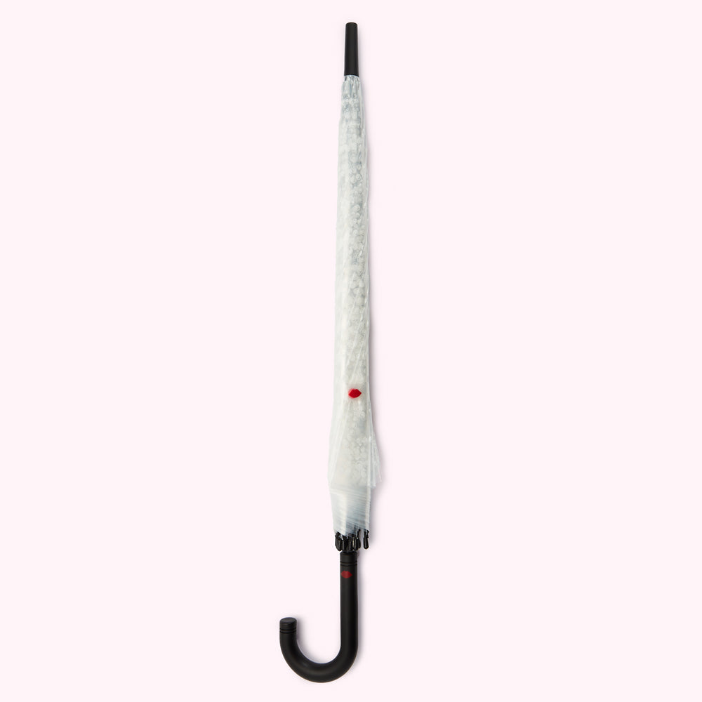 White umbrella with black handle against a white background.