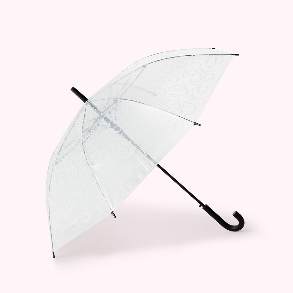 A translucent white umbrella with a black handle and a subtle pattern.
